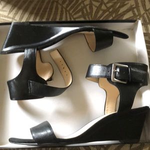 Lightly worn black Nine West wedge 2 1/2 inch heel.